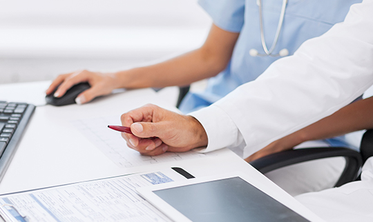 Medical staff viewing reports