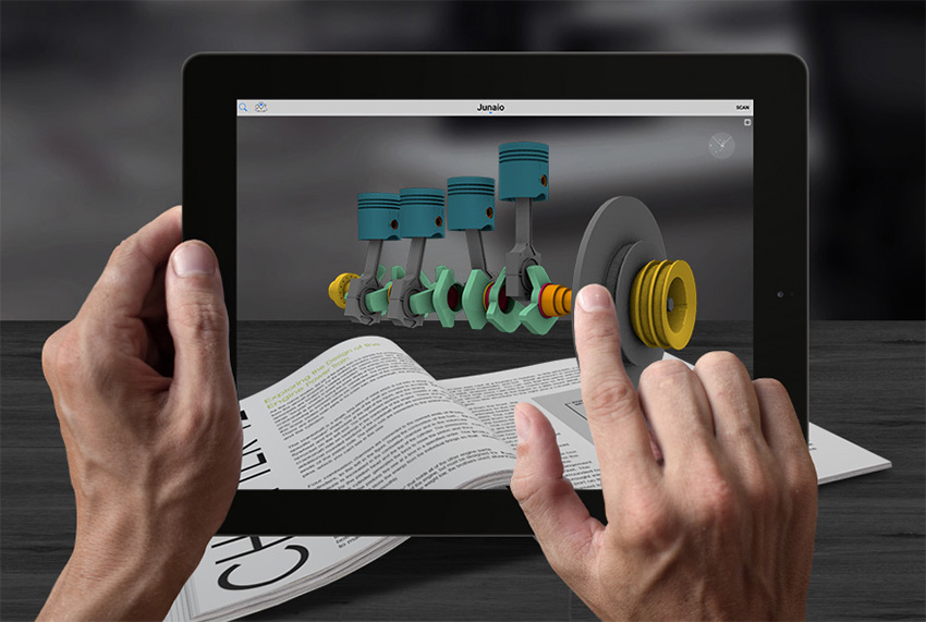 Tablet displaying an augmented reality model of pistons